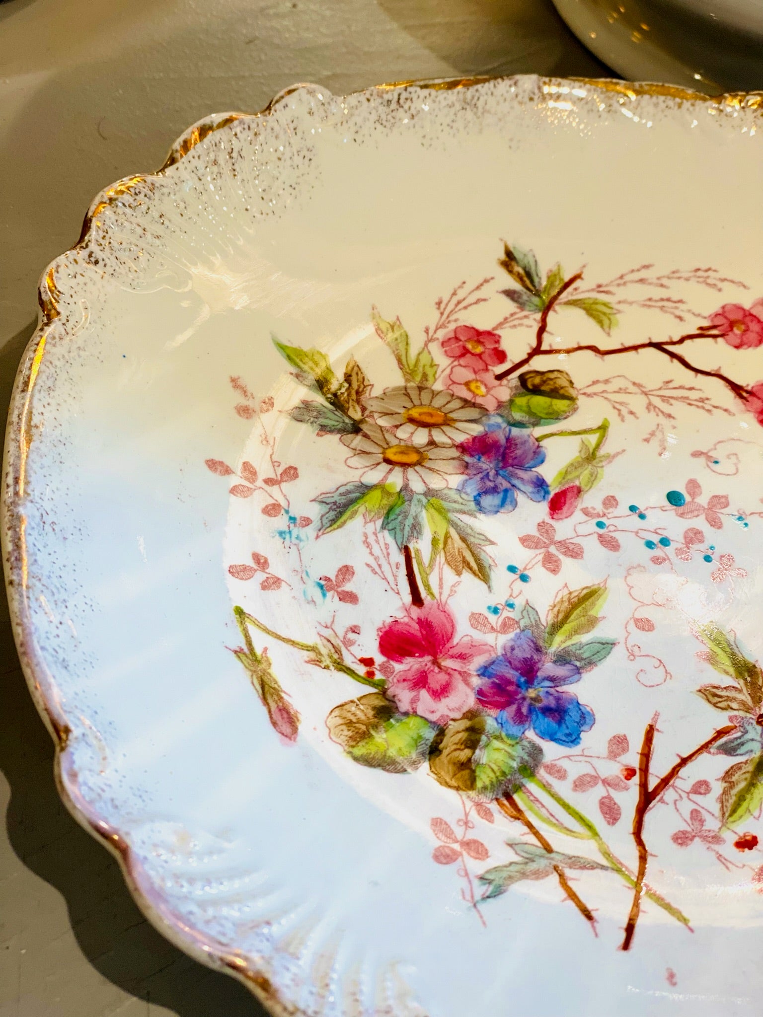 Vintage porcelain flower plate with gold rim